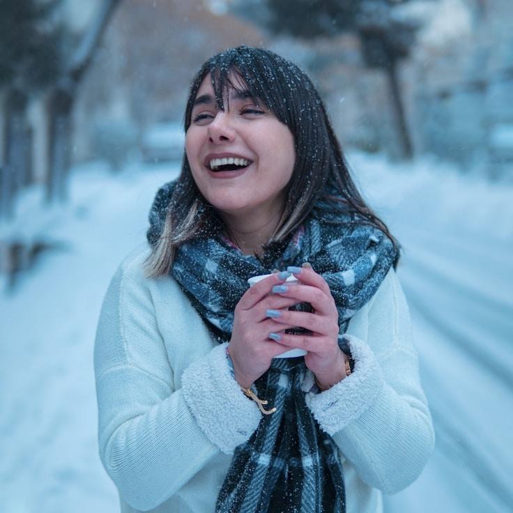 Lina Armand, Lead Design Curator at FrameGroveEvening, reviewing corporate floral arrangements